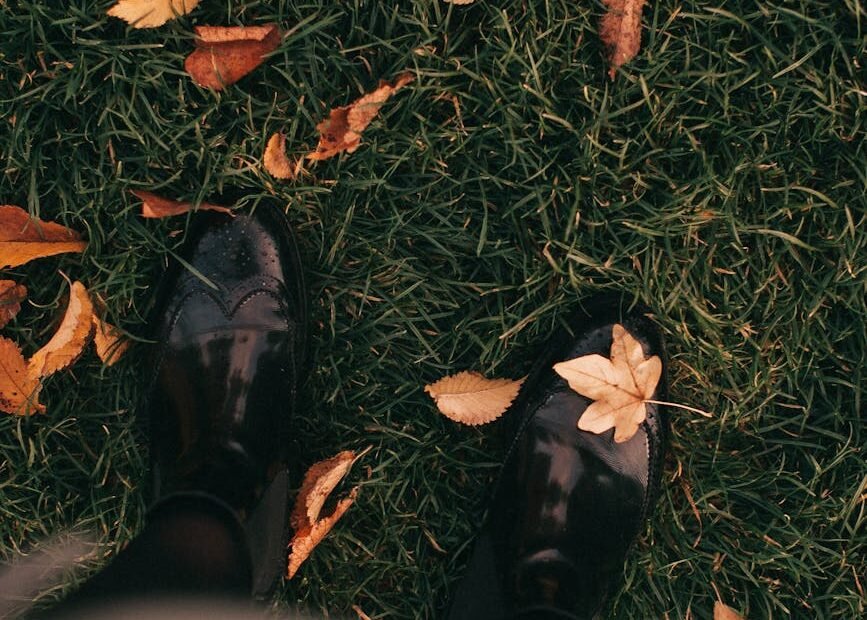 person standing on grass