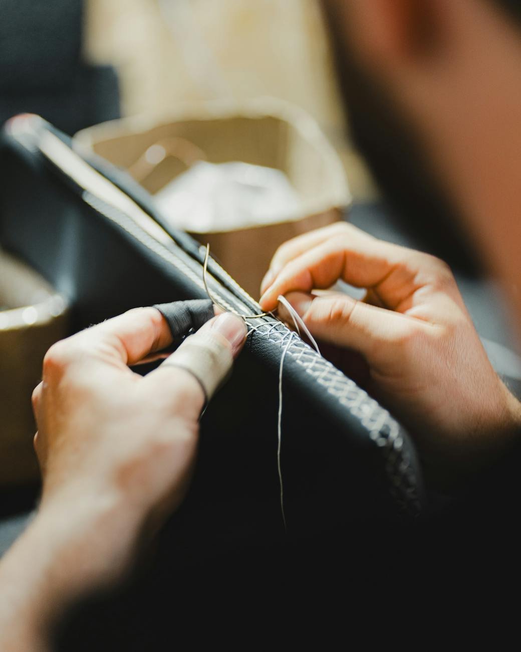 skilled artisan crafting leather goods by hand